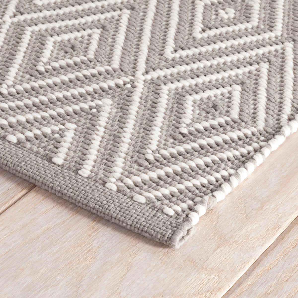 Diamond Indoor/Outdoor Rug, Fieldstone/Ivory, styled in a room - Starboard Lane