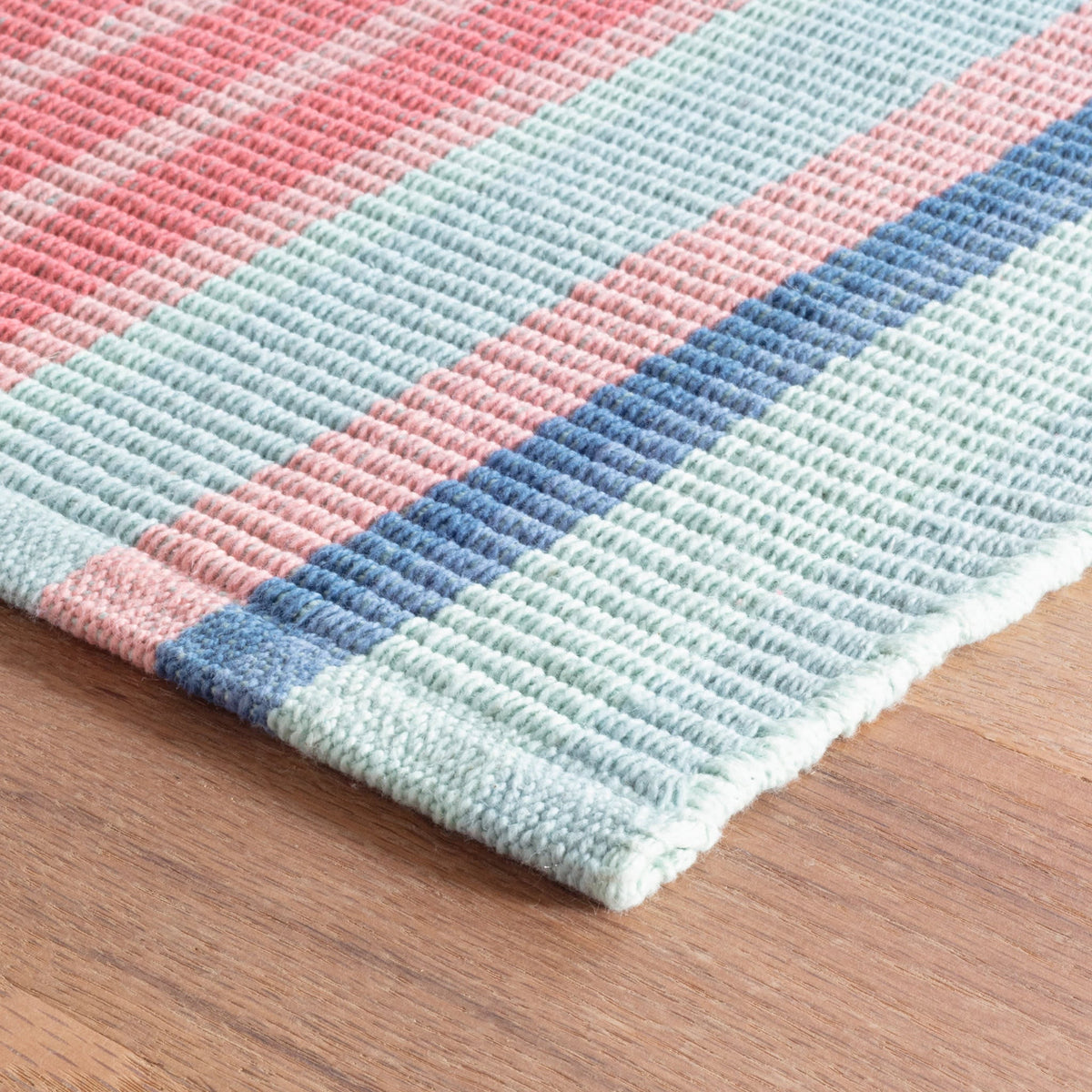Aruba Stripe Handwoven Cotton Rug, styled in a room - Starboard Lane