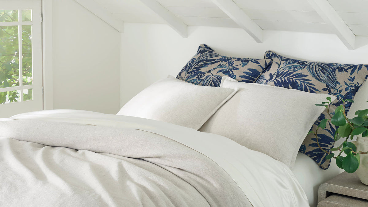 Antigua Linen Sham - Blue, styled on the bed - Starboard Lane