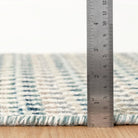 Poppy Handwoven Wool Rug, Blue, styled in a room - Starboard Lane