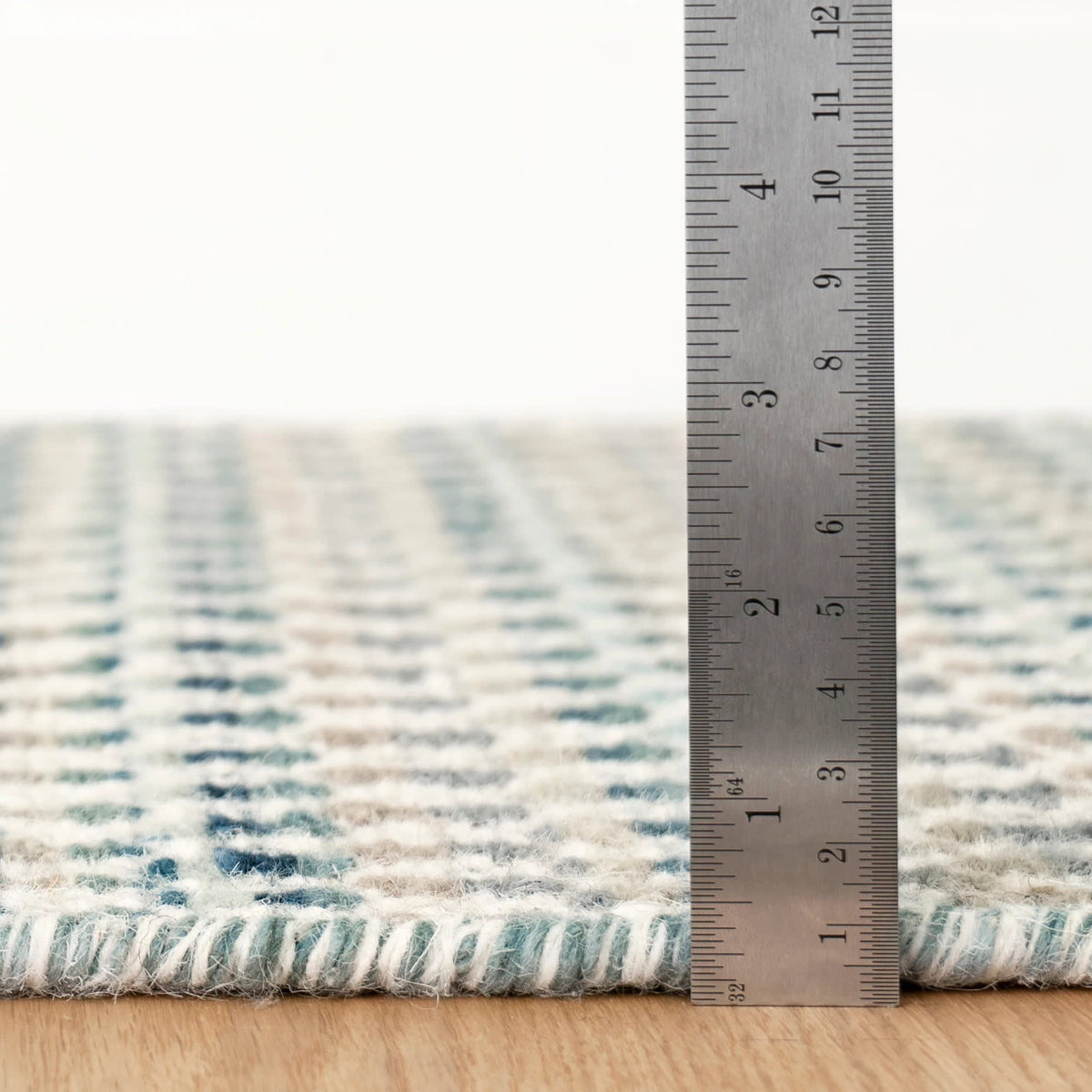 Poppy Handwoven Wool Rug, Blue, styled in a room - Starboard Lane