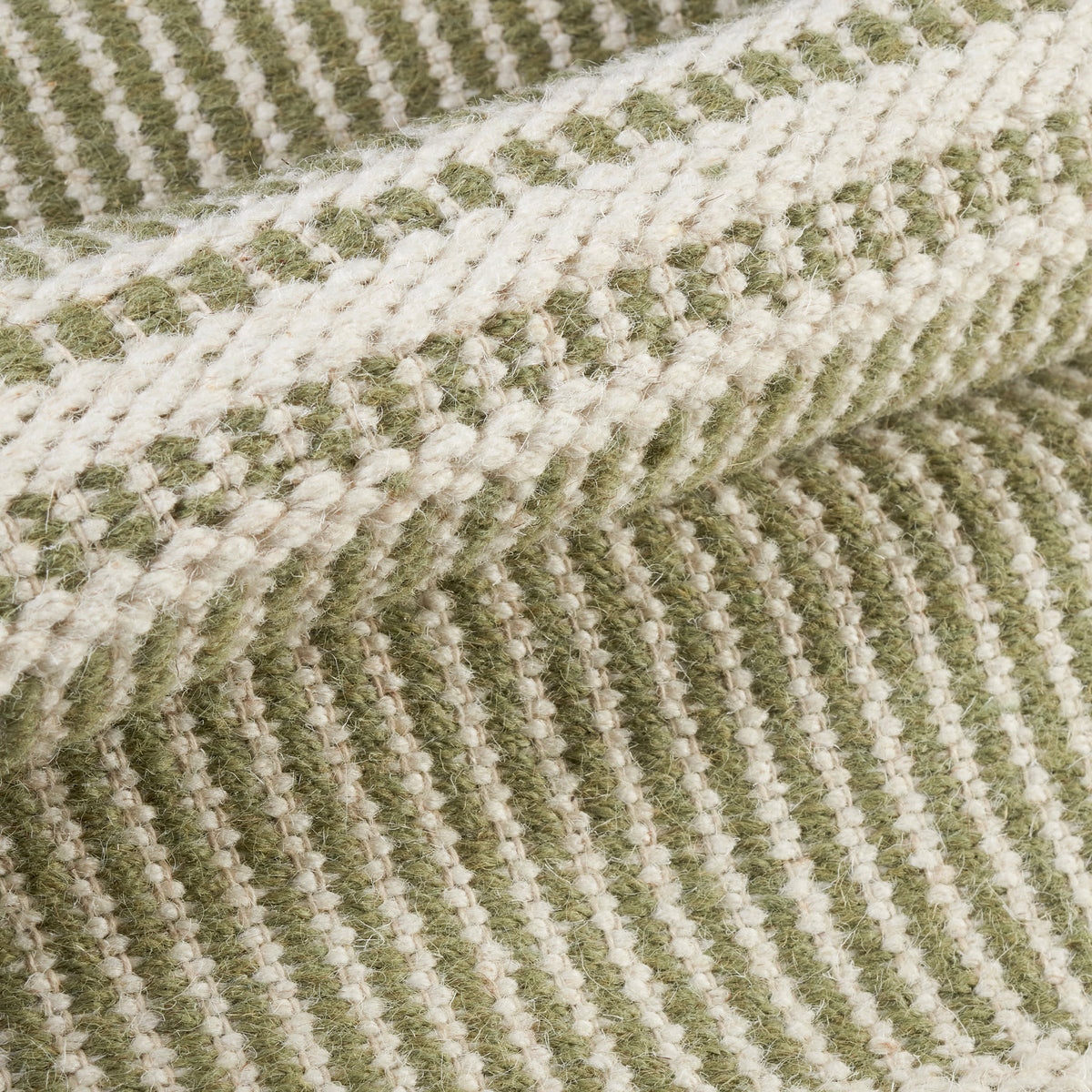 Malta Handwoven Wool Rug, Sage, styled in a room - Starboard Lane