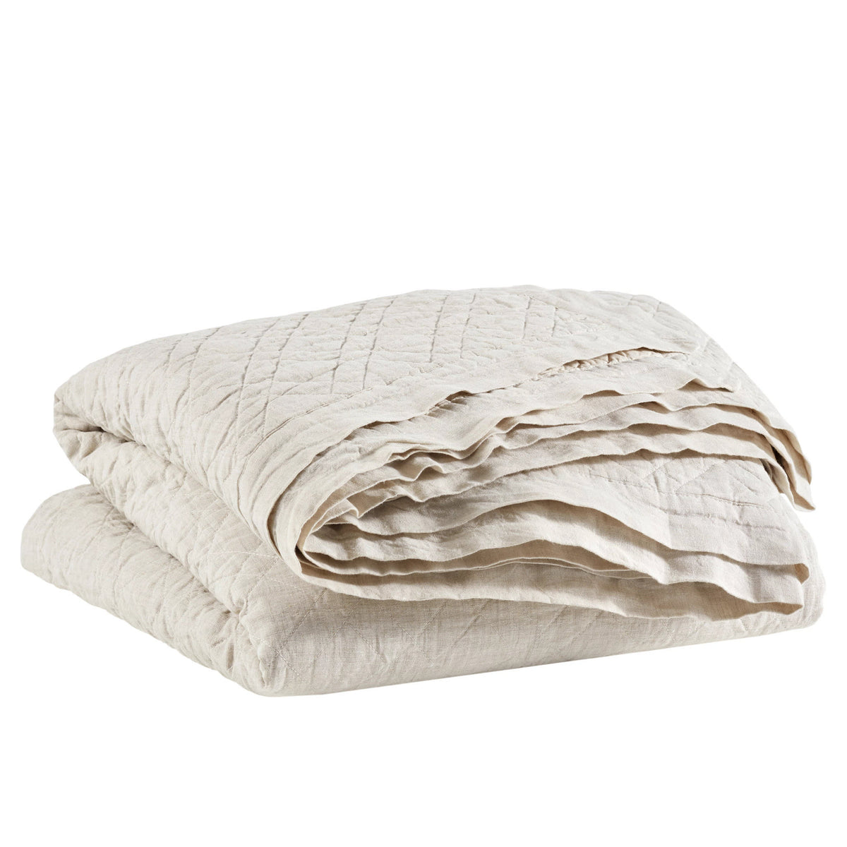 Washed Linen Quilt, Natural, styled on the bed - Starboard Lane
