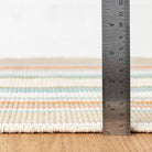 Daphne Stripe Handwoven Cotton Rug, Sky, styled in a room - Starboard Lane