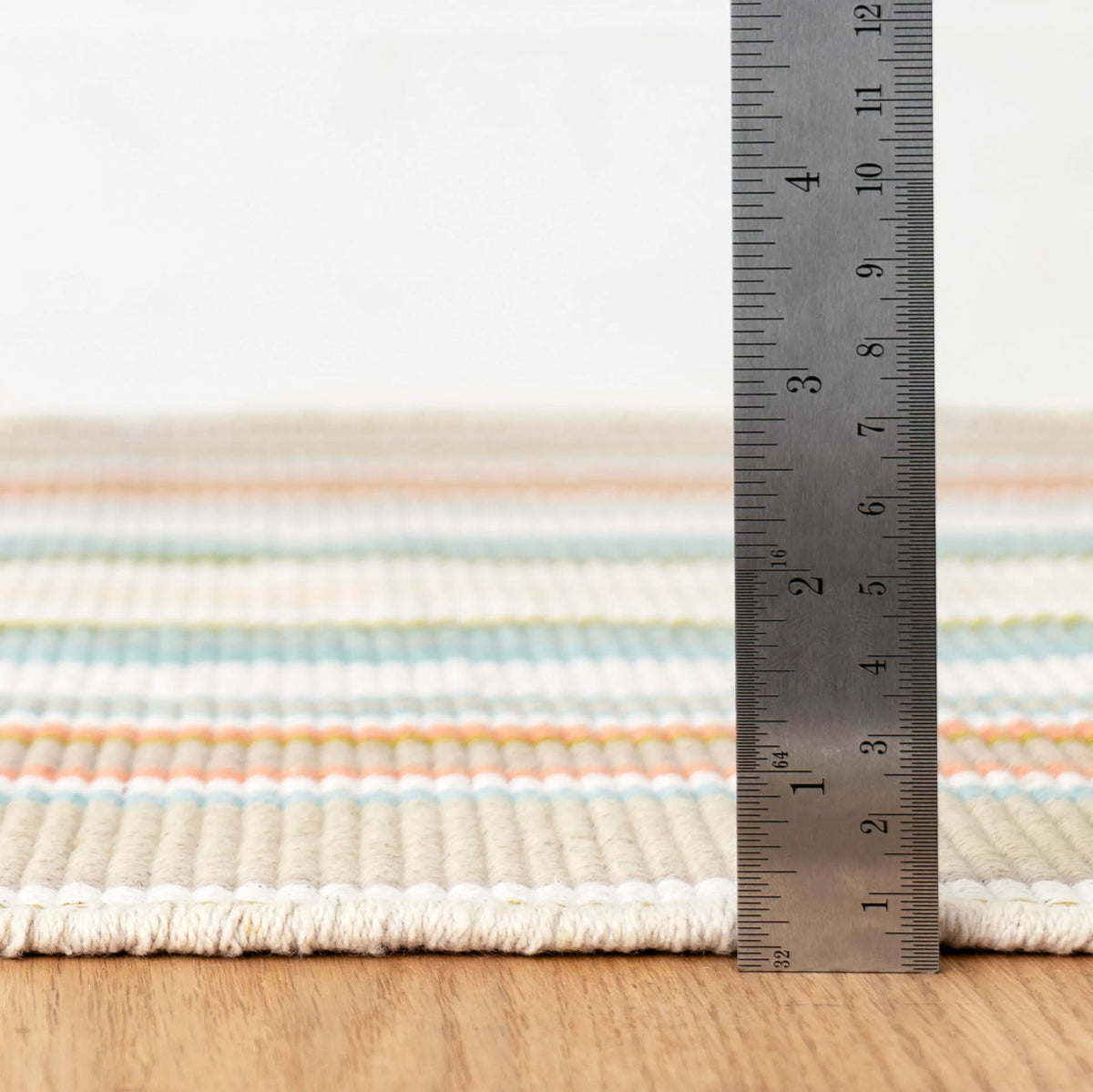 Daphne Stripe Handwoven Cotton Rug, Sky, styled in a room - Starboard Lane