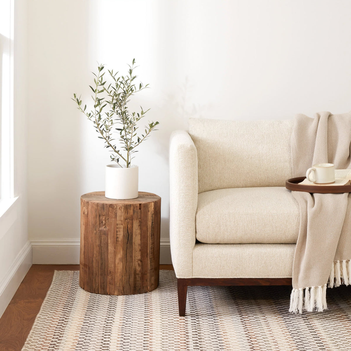 Poppy Handwoven Wool Rug, Natural, styled in a room - Starboard Lane