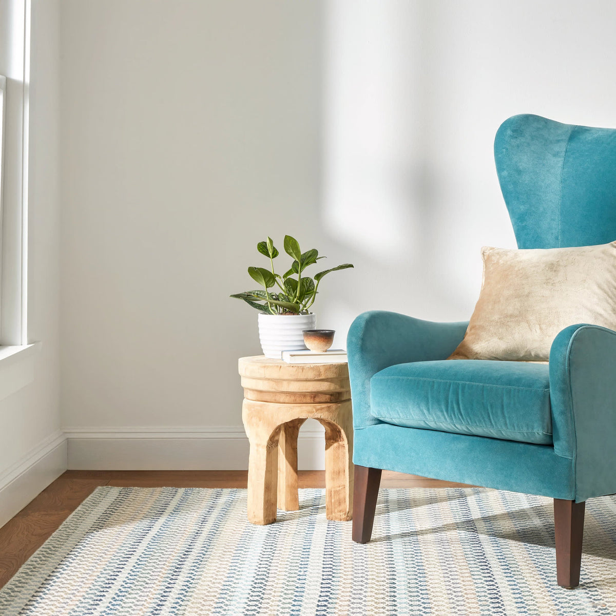 Poppy Handwoven Wool Rug, Blue, styled in a room - Starboard Lane