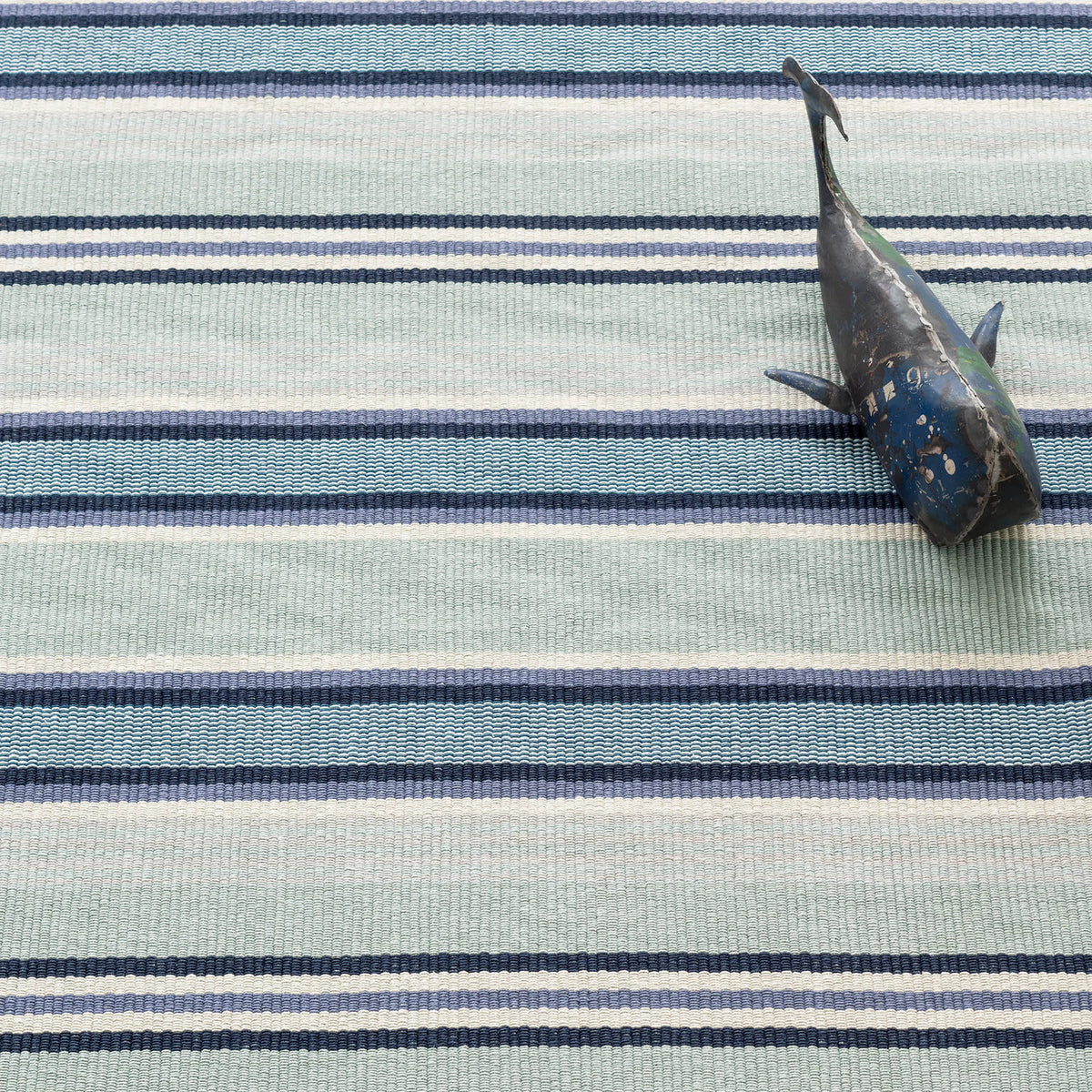 Barbados Stripe Handwoven Cotton Rug - Blue, styled in a room - Starboard Lane