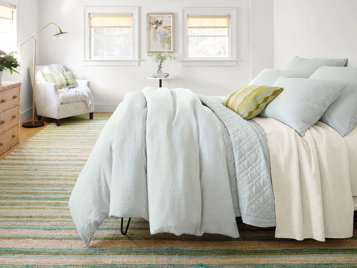 Washed Linen Quilt, Sky, styled on the bed - Starboard Lane