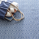 Diamond Indoor/Outdoor Rug, Denim/White, styled in a room - Starboard Lane