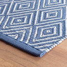 Diamond Indoor/Outdoor Rug, Denim/White, styled in a room - Starboard Lane