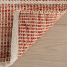 Malta Handwoven Wool Rug, Pink, styled in a room - Starboard Lane