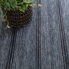 Malta Handwoven Wool Rug, Navy, styled in a room - Starboard Lane
