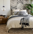 Kali Handwoven Jute Rug - Natural, styled in a room - Starboard Lane