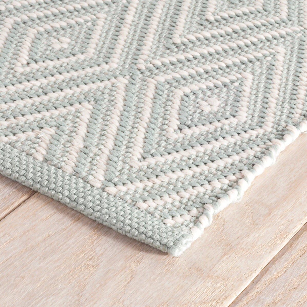 Diamond Indoor/Outdoor Rug, Light Blue/Ivory, styled in a room - Starboard Lane