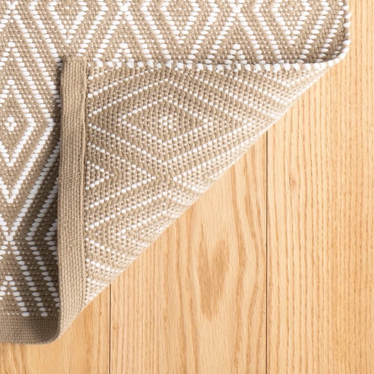 Diamond Indoor/Outdoor Rug, Khaki/White, styled in a room - Starboard Lane
