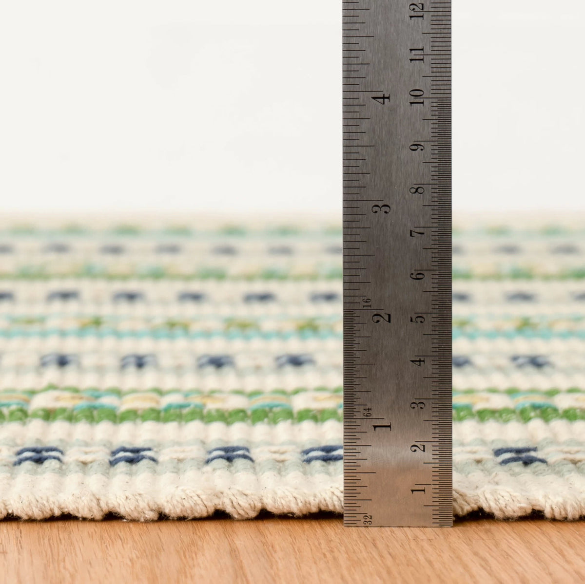 Long Slade Handwoven Cotton Rug, Teal, styled in a room - Starboard Lane