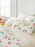 Silken Solid Sheet Set, Ivory, styled on the bed - Starboard Lane