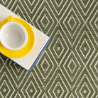 Diamond Indoor/Outdoor Rug, Sage, styled in a room - Starboard Lane