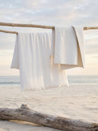 Washed Linen Quilt, White, styled on the bed - Starboard Lane